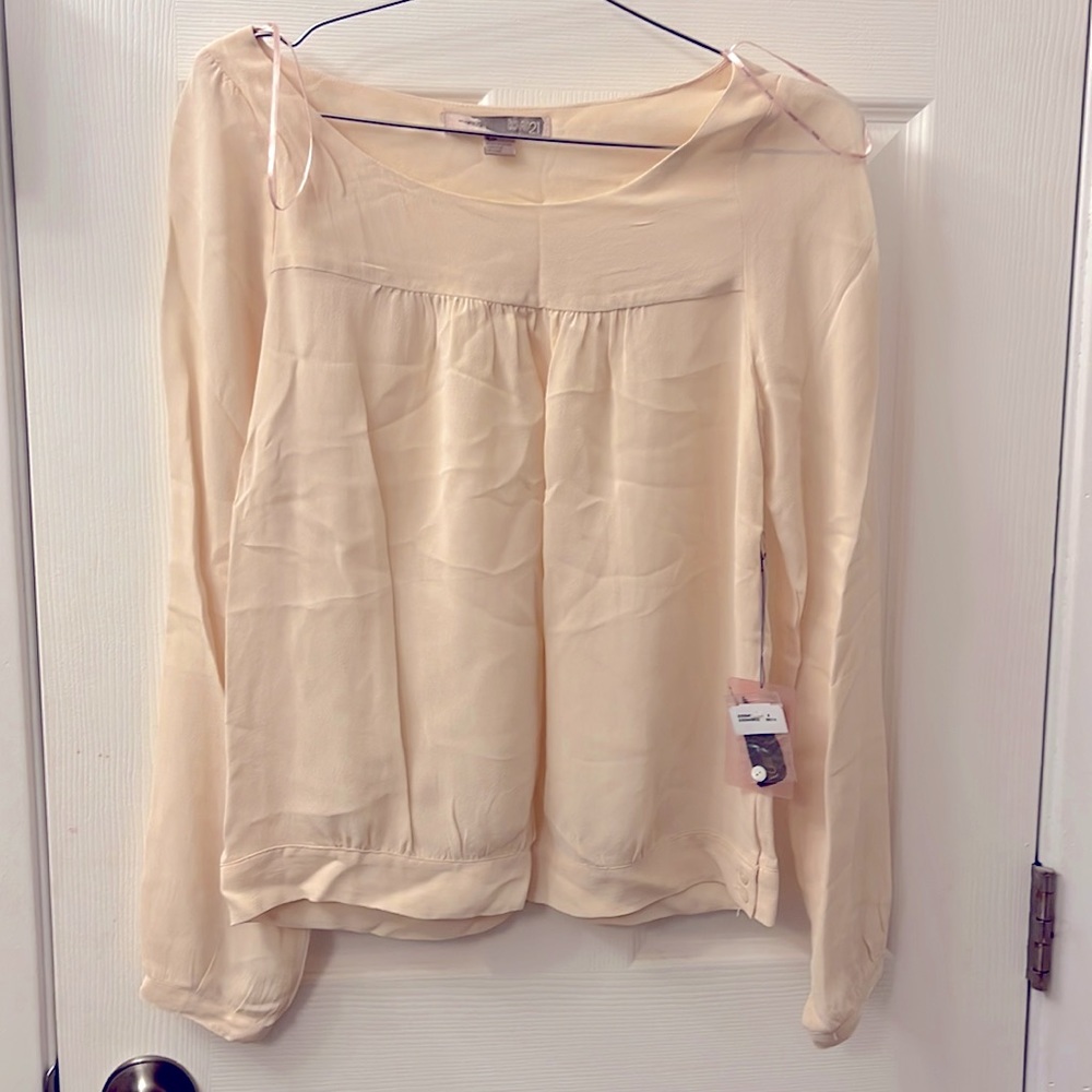 NWT pink top with extra detail on the waist.